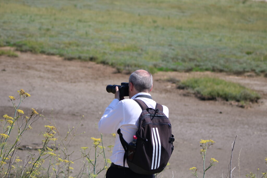 Dave taking a photograph; Pegwell Bay trip; July 2024; Matt
